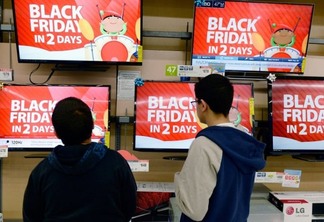 Customers shop at a Walmart store in the Porter Ranch section of Los Angeles November 26, 2013. This year, Black Friday starts earlier than ever.